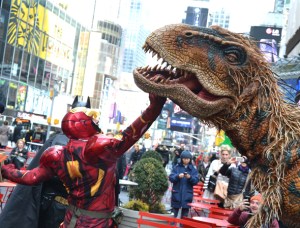 <em>Walking With Dinosaurs</em> Star Baby T Meets Batman, Iron Man, and Woody in Times Square